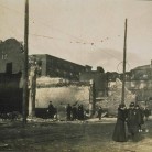 Policeman and woman in front of ruins on Bank Street, Waterbury