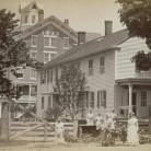 Shaker women and buildings, Enfield, 1890s