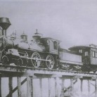 Locomotive number 9 "the Simsbury" going over a trestle bridge, 1878