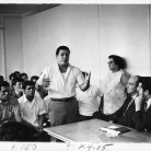 Maria Sánchez (leaning against the wall) in a meeting with city officials, Hartford, 1969