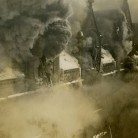 Firemen on ladders combat smoke pouring from the roof, Union Station, Hartford
