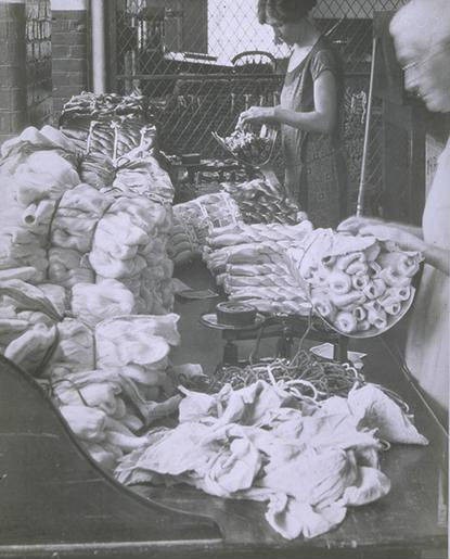 Women weighing raw silk