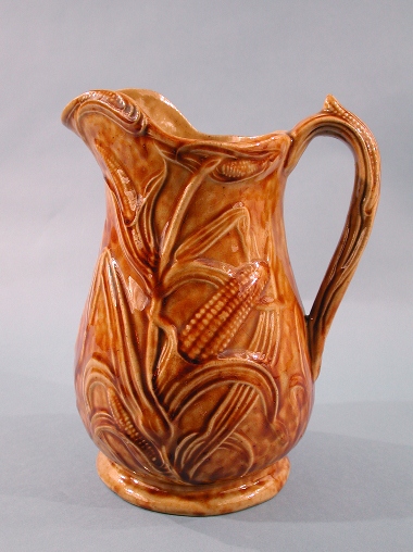 Mold-formed stoneware pitcher. Made by Sidney Risley, 1850-1875