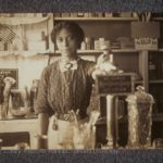 Anna Louise James behind the soda fountain in the James' pharmacy