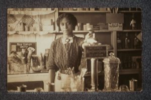 Anna Louise James behind the soda fountain in the James' pharmacy