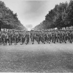 American troops of the 28th Infantry Division march down the Champs-Élysées