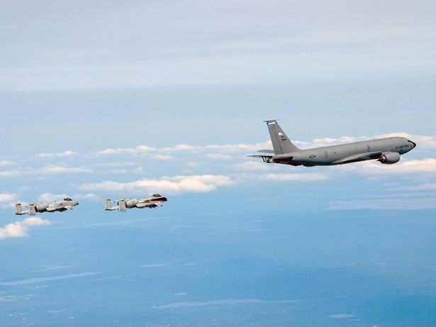 Two A-10 Thunderbolt IIs from the Connecticut Air National Guard's 103rd Fighter Wing fly in formation behind a KC-135
