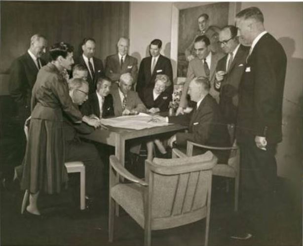 Beatrice Fox Auerbach meets with the department heads of her store, G. Fox & Company