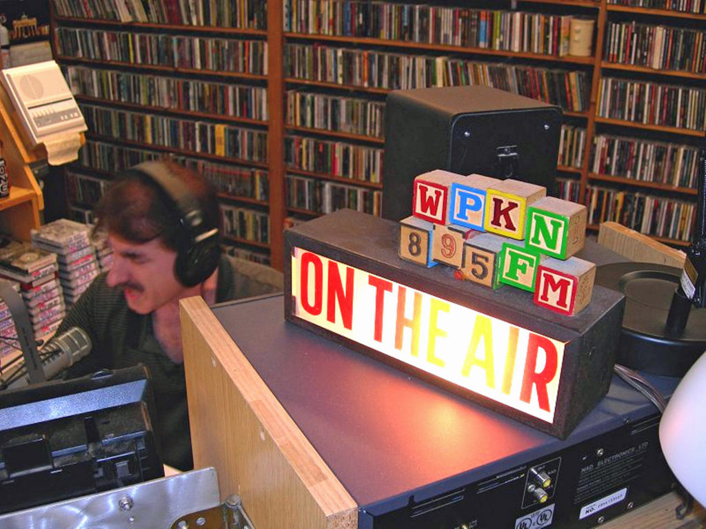 WPKN blocks on top of an on the air sign in the WPKN radio station