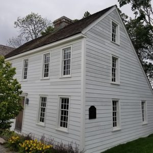Side profile of a white wood house