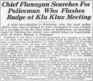 Newspaper clipping with the headline "Chief Flanagan Searches for Policeman Who Flashes Badge at Klu Klux Meeting"