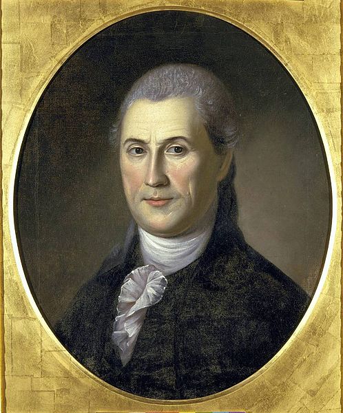 Portrait of a man dressed in 18th century clothing. He is wearing a black suit with a white neckcloth