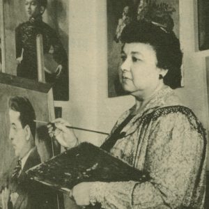 Black and white photograph of a woman painting a man