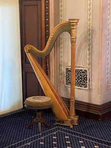 Harp instrument in the corner of a room