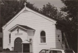 Black and white photograph of a white church
