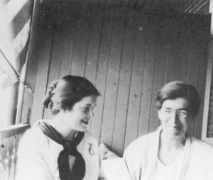 Two women sitting next to each other