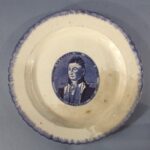 Earthenware plate with blue decoration